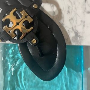 Tory Burch flip flops black and gold